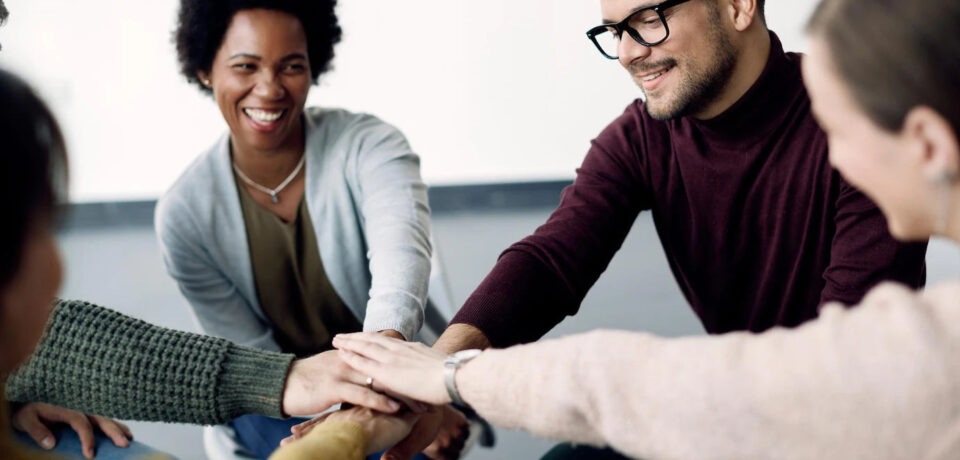 attenders-group-therapy-joining-hands-unity-during-meeting_637285-9993_result